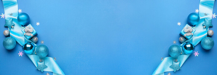 Stylish Christmas decor on blue background with space for text