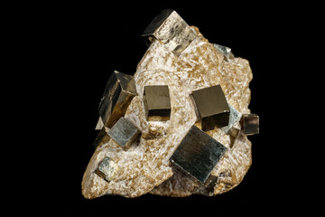 Macro stone Pyrite mineral in rock on a black background