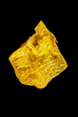 Macro stone Orpiment mineral on black background