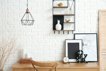 Stylish workplace in room near wall