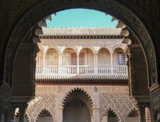 Patios, courtyards garden halls hallways colonnades frescoes tiles pillars in Moorish Arabian...