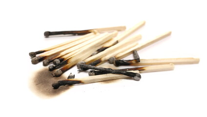 Burnt fire matches pile, burned matchsticks group isolated on white background