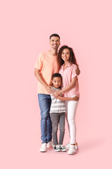 Happy interracial family on color background