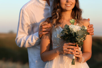 Happy wedding couple in countryside