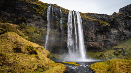 Panorama photo by Seljalandsfoss waterfall on Ring Road in beautiful nature landscape on Iceland. Beautiful waterfall in Southern Iceland