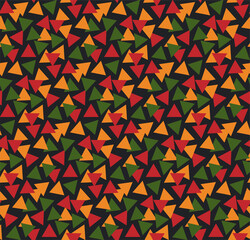 Bright abstract geometric seamless pattern with triangles in traditional African colors red, yellow, green on black background. Ditsy backdrop for Kwanzaa, Black History Month, Juneteenth design