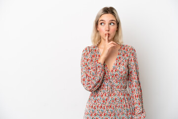 Young caucasian woman isolated on white background showing a sign of silence gesture putting finger...