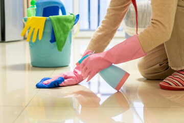 The housewife cleans the house carefully
