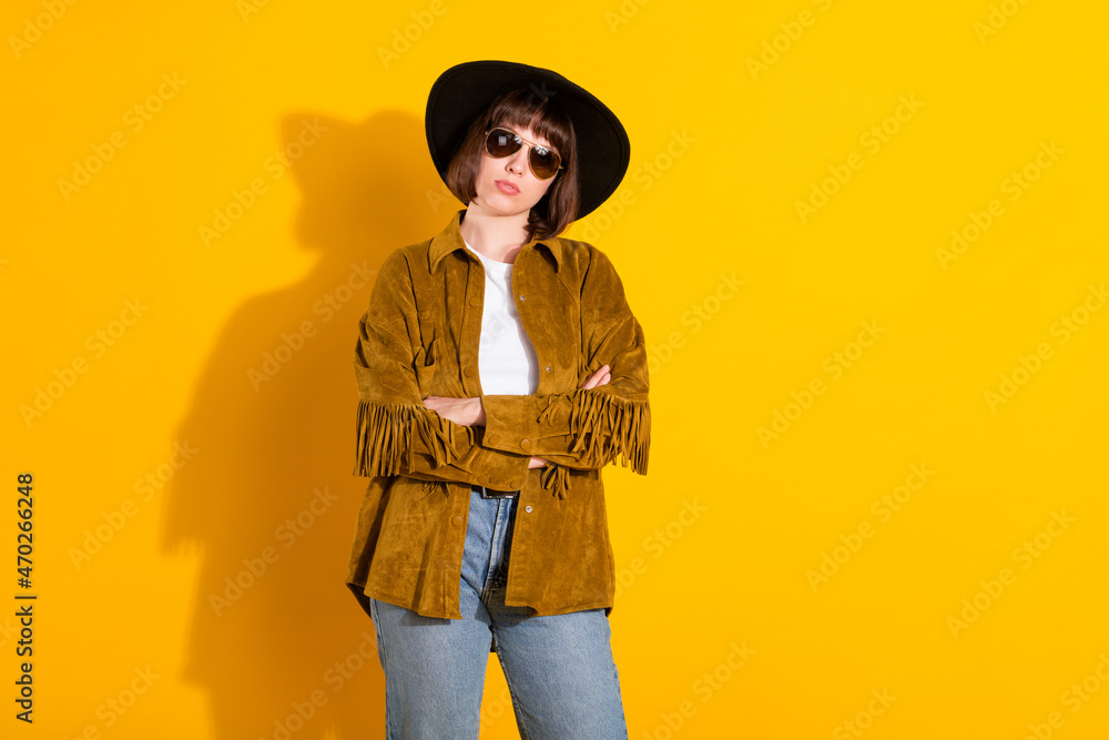 Sticker Photo of adorable confident woman dressed cowboy clothes spectacles cap arms crossed empty space isolated yellow color background