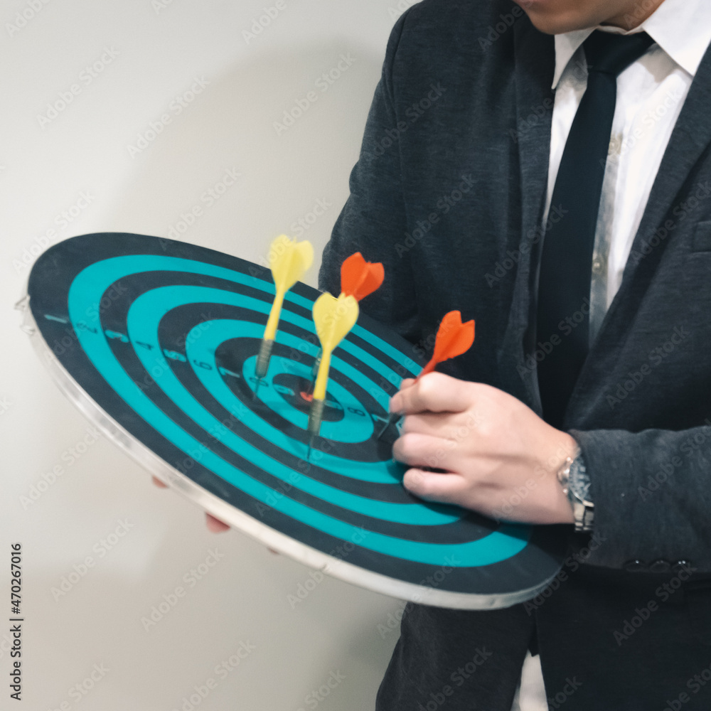 Poster bullseye is a target of business. dart is an opportunity and dartboard is the target and goal. so bo