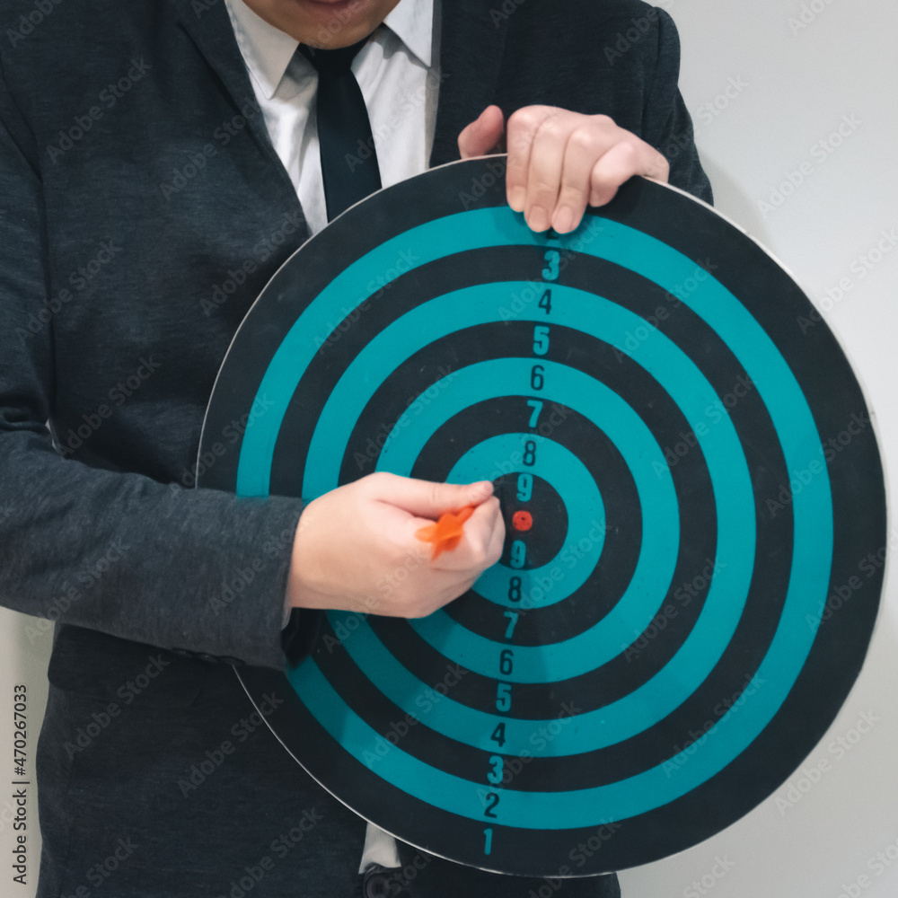 Poster bullseye is a target of business. dart is an opportunity and dartboard is the target and goal. so bo