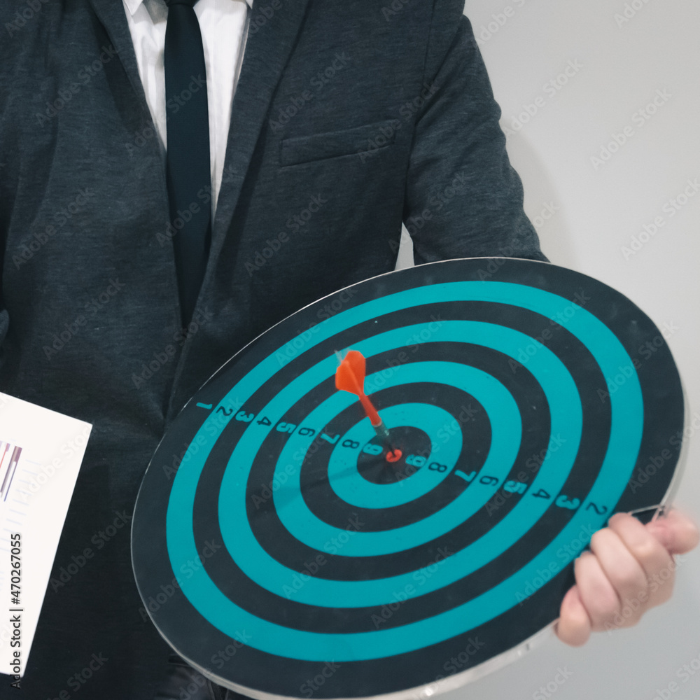 Poster bullseye is a target of business. dart is an opportunity and dartboard is the target and goal. so bo