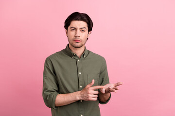 Photo of unhappy young upset angry man count fingers bad mood offended isolated on pink color...