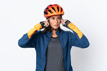 Young cyclist brazilian girl isolated on white  background having doubts and thinking