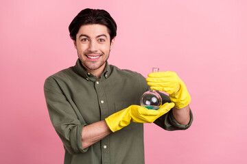 Photo of cheerful laborant worker guy demonstrate flask wear gloves khaki shirt isolated pink color background