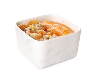 Bowl of tasty oatmeal with pumpkin on white background