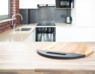 Wood table top on blur kitchen room