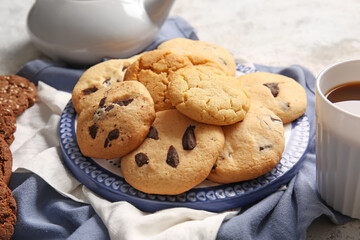 Plate with tasty homemade cookies on light background
