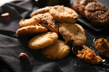 Tasty homemade cookies with raisin on table