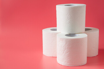Toilet paper on pink background