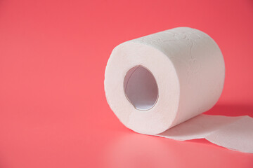 Toilet paper on pink background