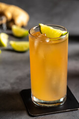 Luxury cocktail and cocktail shaker on black stone background