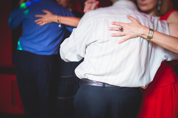 Couples dancing traditional latin argentinian dance milonga in the ballroom, tango salsa bachata...