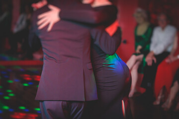 Couples dancing traditional latin argentinian dance milonga in the ballroom, tango salsa bachata...