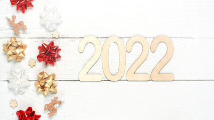 Fototapeta na wymiar Wooden 2022 numbers on White background. Minimal concept of Xmas and New Year