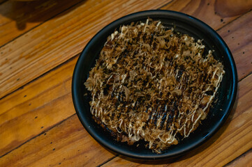Top view of Japanese Pizza Okonomiyaki at Sapporo ramen restaurant in Bangkok Thailand