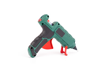 Fototapeta na wymiar Green electric glue gun, useful accessory for homes isolated