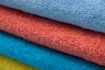 Composition of colored cotton towels. The concept of softness and purity