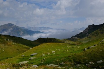 Beautiful mountain view above clouds during hiking on peak Djeravica (Gjerovica) - the highest peak of Kosovo. Albanian Alps, Peaks of Balkans