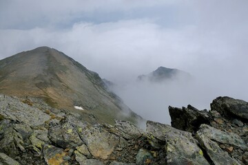 Beautiful mountain view above clouds from peak Djeravica (Gjerovica) - the highest peak of Kosovo. Albanian Alps, Peaks of Balkans