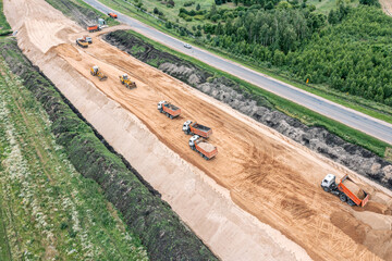aerial view of large road construction site with working construction machines. drone photo.