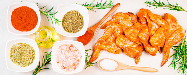 Oven baking wings. Chicken wings are raw in the marinade. Semifinished. Fast cooking.Raw Marinated chicken meat wings for BBQ,Cooking chicken with spices . Grilled chicken wings recipe.