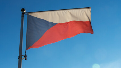 Waving colorful Czech Republic flag on blue sky background. National flag of Czechia.