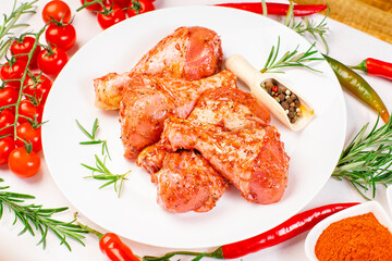 Smoked chicken leg drumsticks with herbs and spices. Raw marinated chicken meat, chicken legs