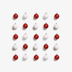 Christmas balls, red and white round bauble with polka dots on white background. Creative holiday winter New year ornaments, minimal pattern
