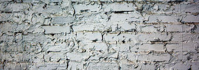 Grey brick wall with smeared contrasting brickwork. Gray, brick texture.
