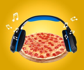 Composition with big pizza and headphones. Fastfood time, funny mood.