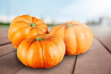 Thanksgiving Day pumpkin on a wooden desk