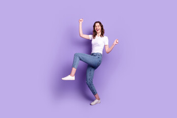 Full size photo of young excited lady good mood rejoice victory fists hands isolated over purple color background