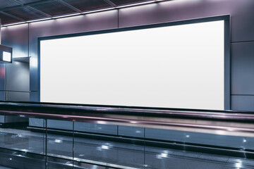 An empty billboard mockup next to a travelator in a modern airport arrival area; a white blank...