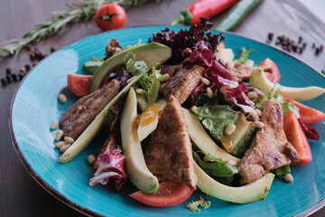 Grilled beef meat salad on wooden table