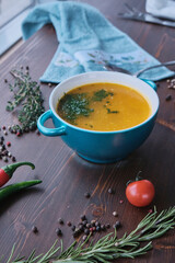 Carrot soup on wooden background