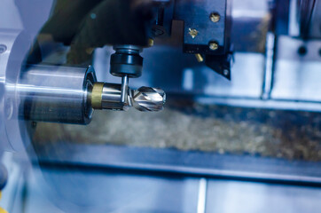 The CNC milling machine in metal working process.