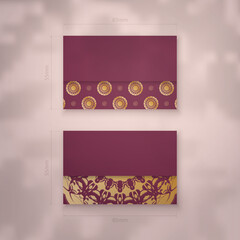 Burgundy business card with antique gold ornaments for your personality.