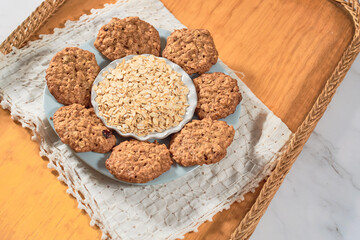 Homemade oatmeal cookies and oat flakes. Healthy dessert concept.