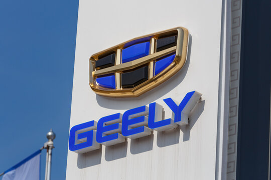 Geely logo on car dealership pillar at sunny day - Geely is one of the largest Chinese automobile manufacturer